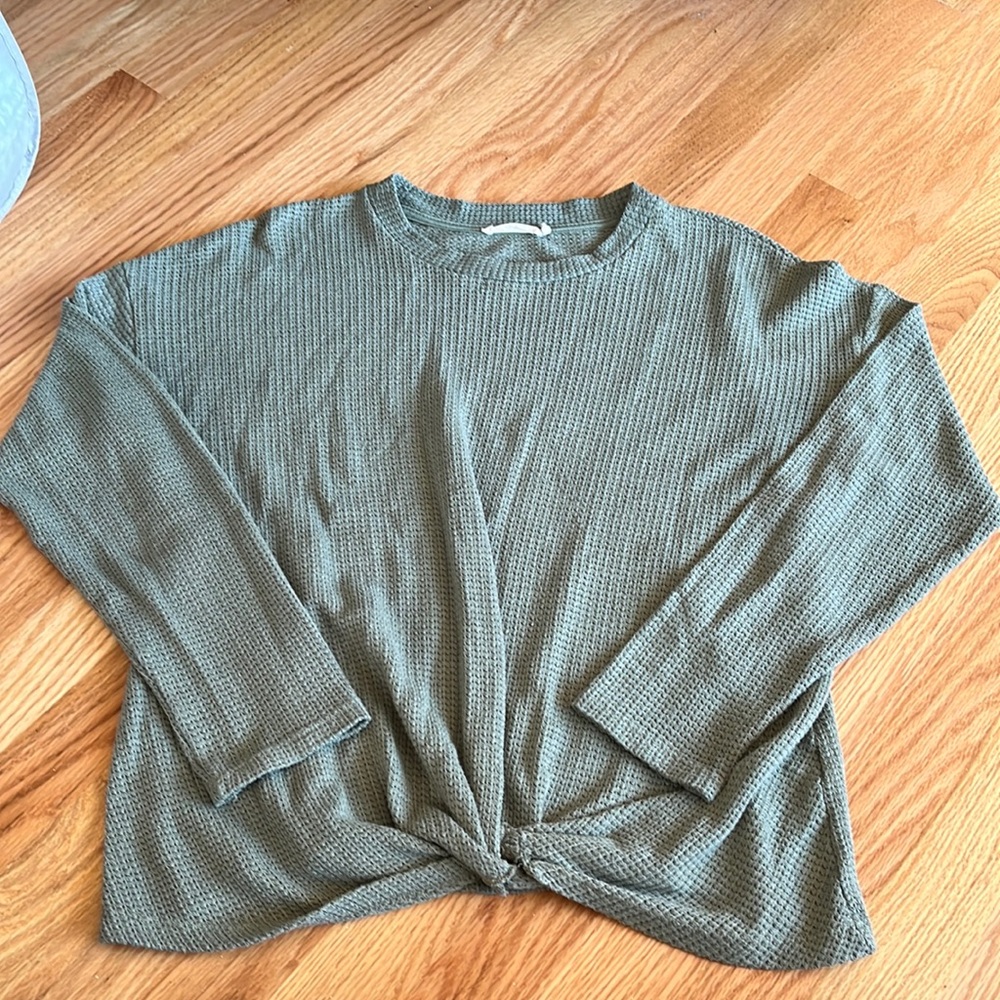 Green sweater with knotted front